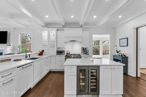 a kitchen with sink stove and cabinets