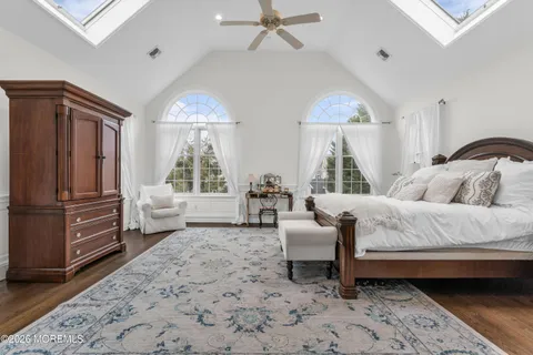 a bedroom with a bed and a television