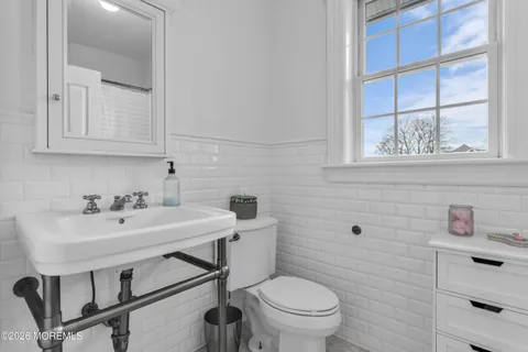 a bedroom with a bed and cabinets