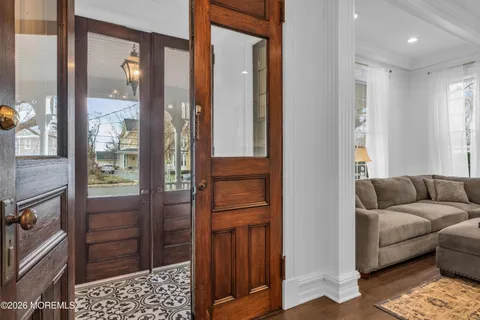 a living room with furniture and a walk in closet