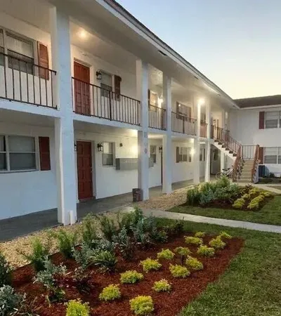 a front view of a house with garden