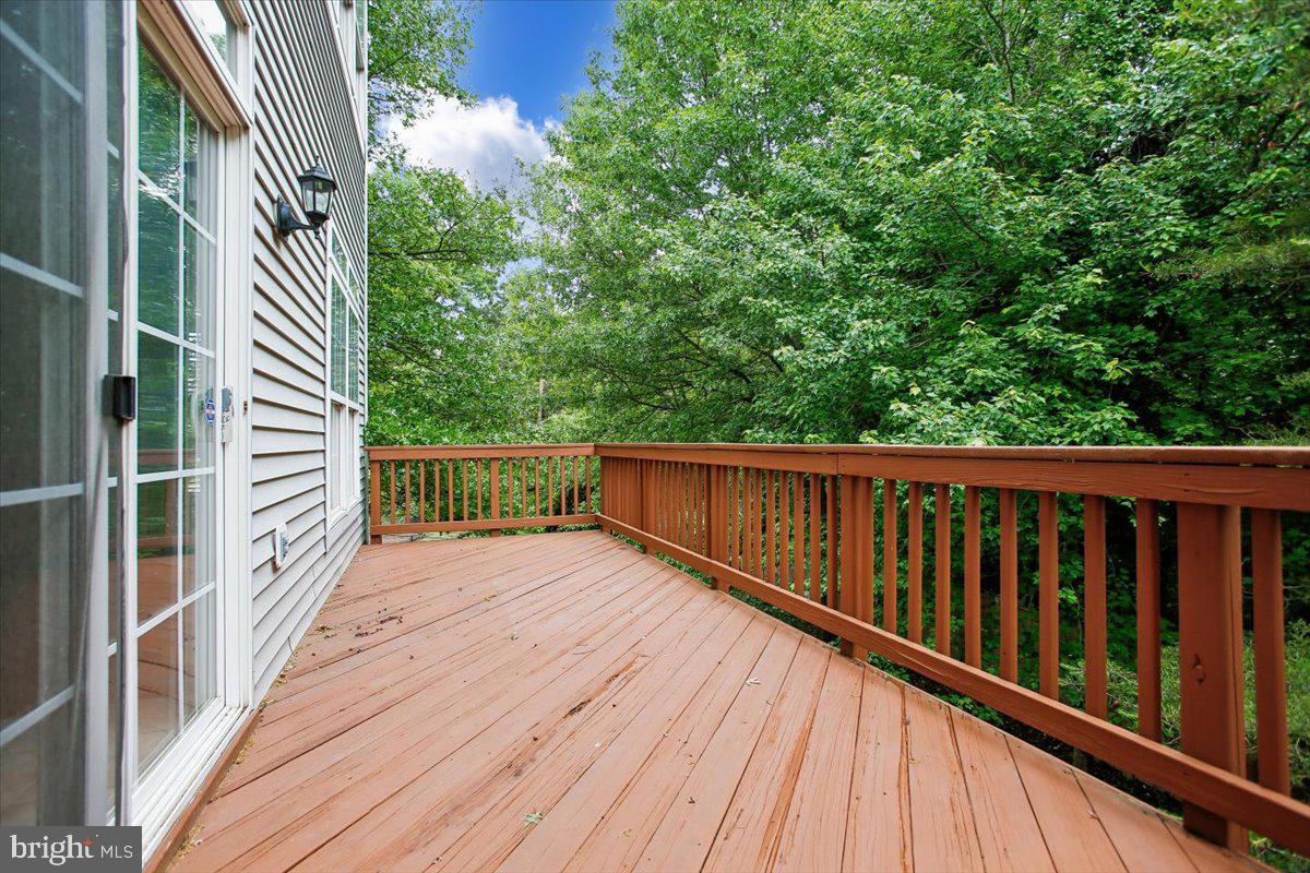 7301 Oldham Leeds Way Springfield, VA 22150 - Photo 11 of 34 Large main level deck with treed views