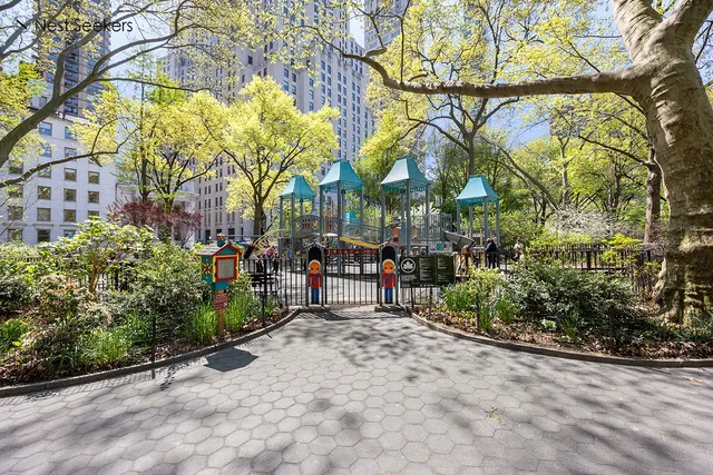 a swimming pool with outdoor seating and yard