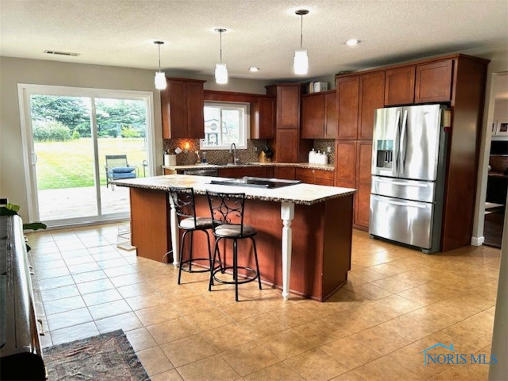 28699 Blanchard Road Defiance, OH 43512 - Photo 17 of 31 Workspace island in kitchen with seating