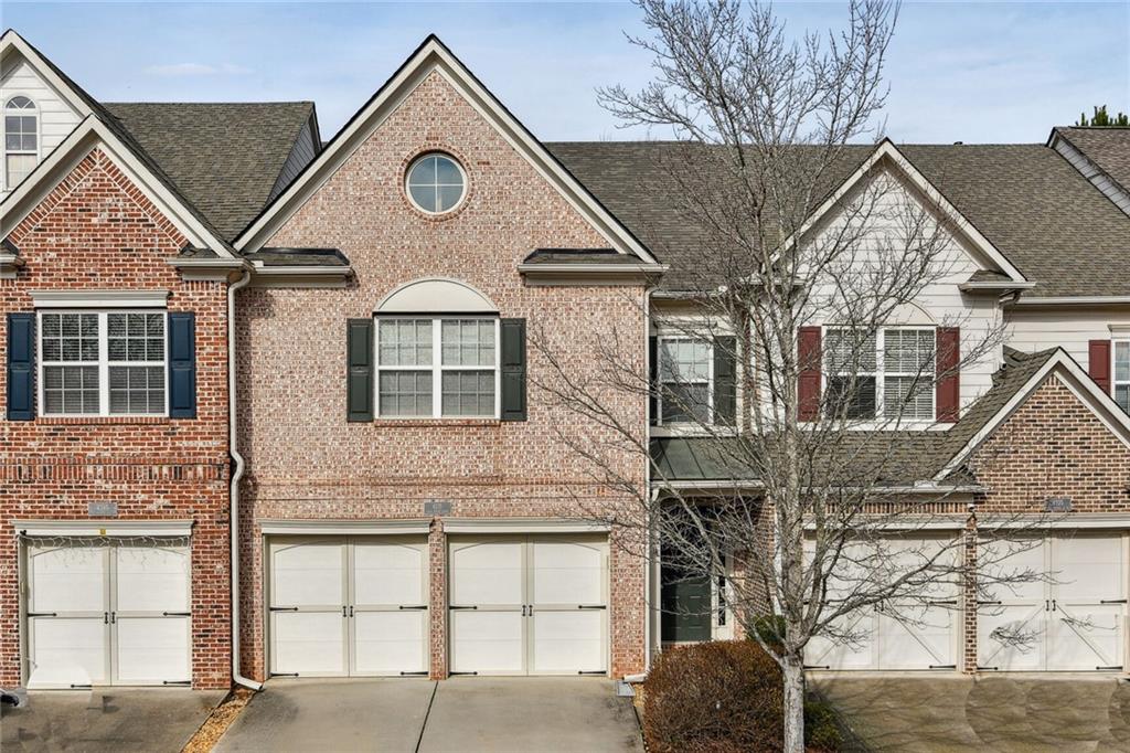 4215 Cold Spring Court Cumming, GA 30041 - Photo 1 of 1 a front view of a house with garage
