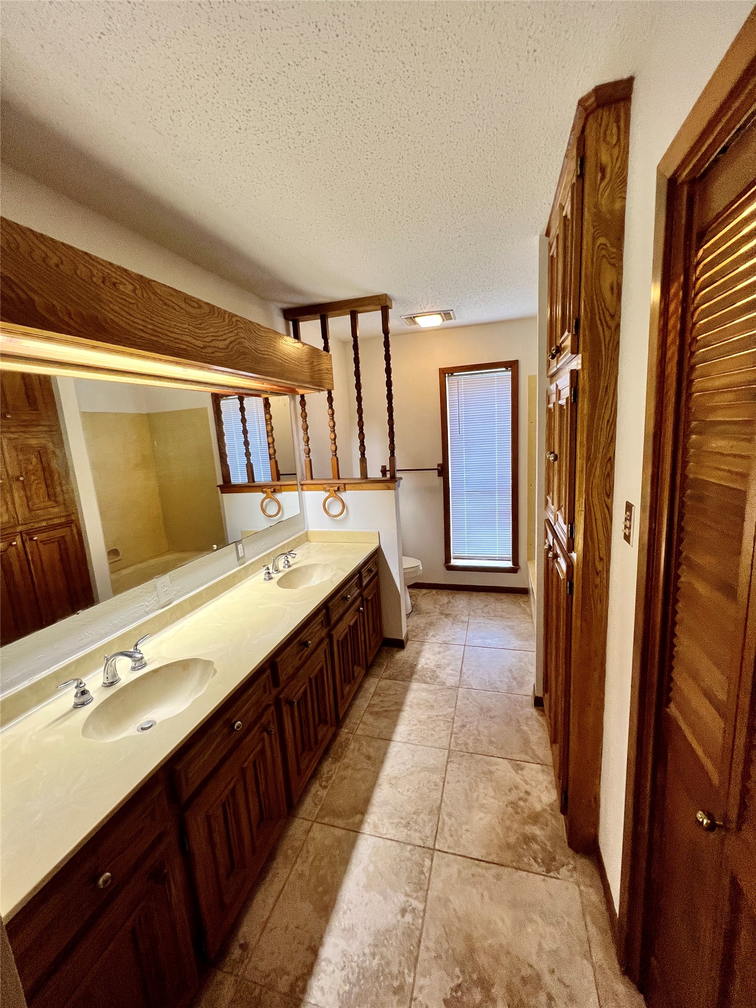 1602 Yokley Road Rockdale, TX 76567 - Photo 13 of 40 a bathroom with a double vanity sink and mirror