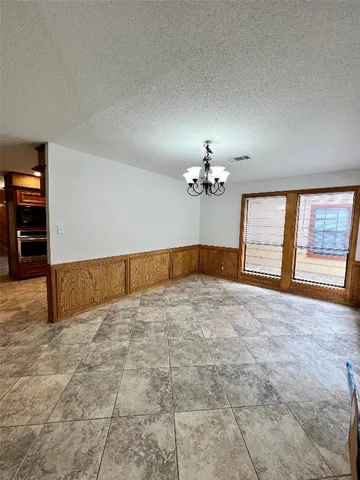 a view of empty room with ceiling fan