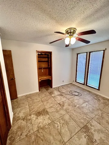 a view of an empty room with stairs