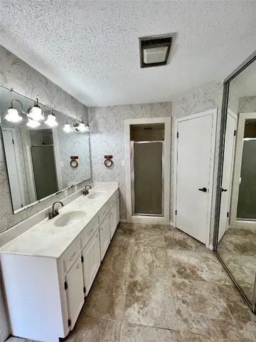 a bathroom with a bathtub and shower