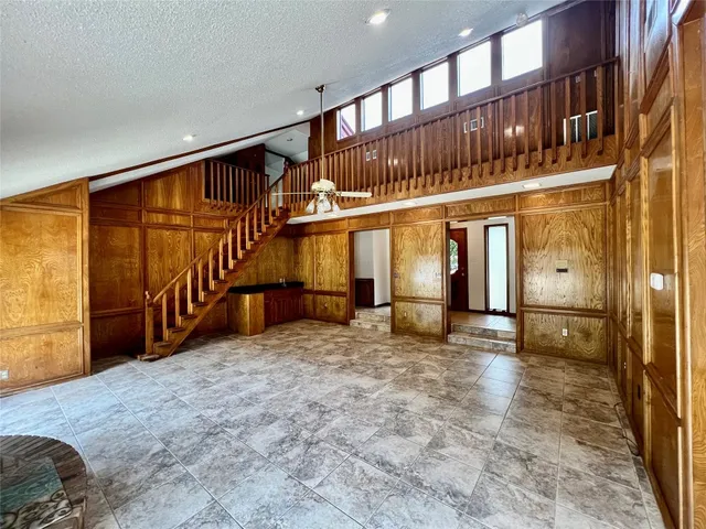 a big house with a tree in front of it