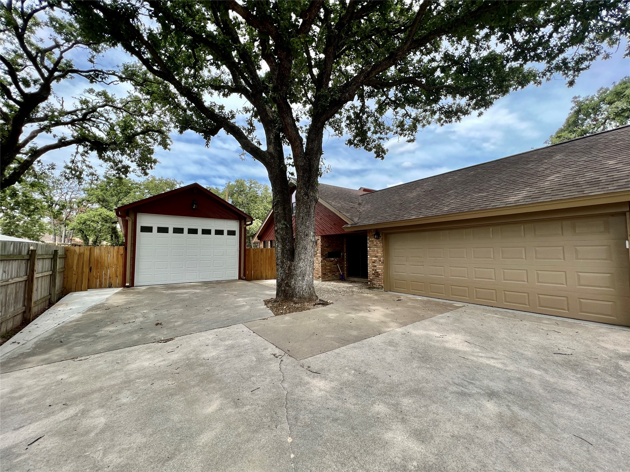 1602 Yokley Road Rockdale, TX 76567 - Photo 29 of 40 a big house with a tree in front of it