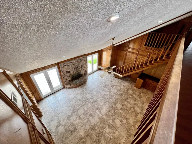 a backyard with a garden and trees