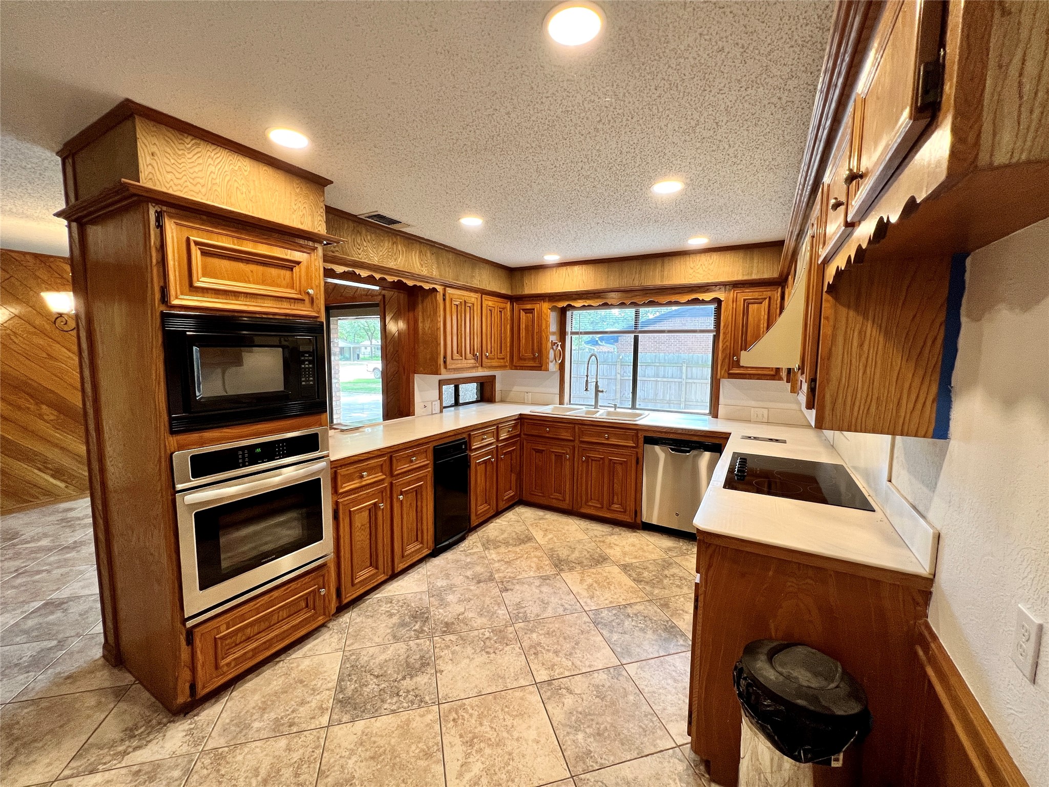1602 Yokley Road Rockdale, TX 76567 - Photo 35 of 40 a kitchen with stainless steel appliances kitchen island granite countertop a refrigerator and a stove top oven
