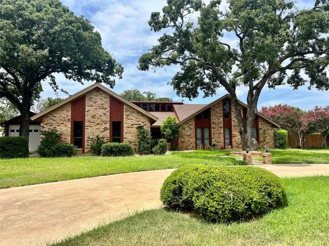 a view of swimming pool with a small yard
