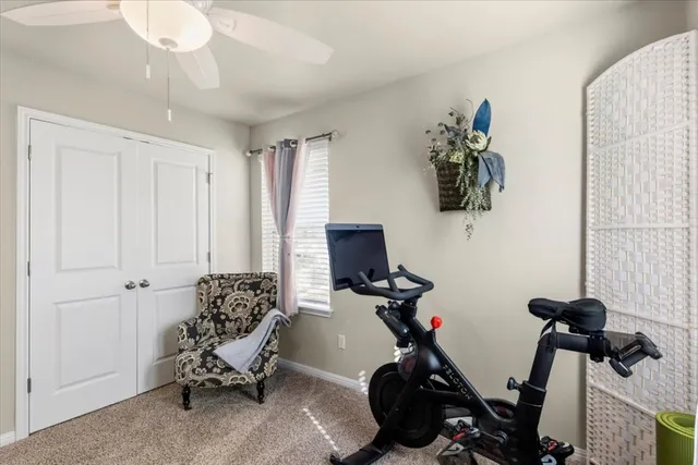 a room with gym equipment and a window