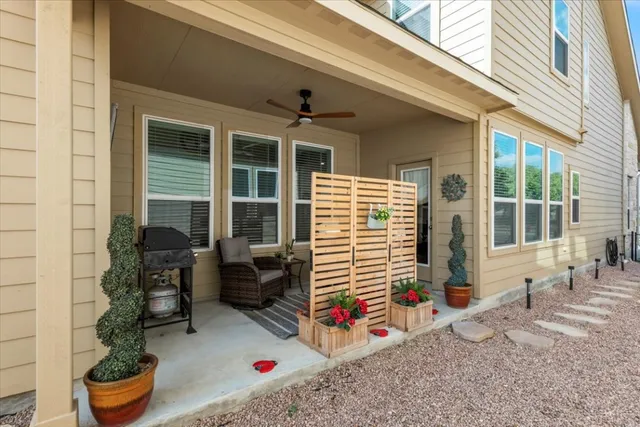 a front view of a house with outdoor seating