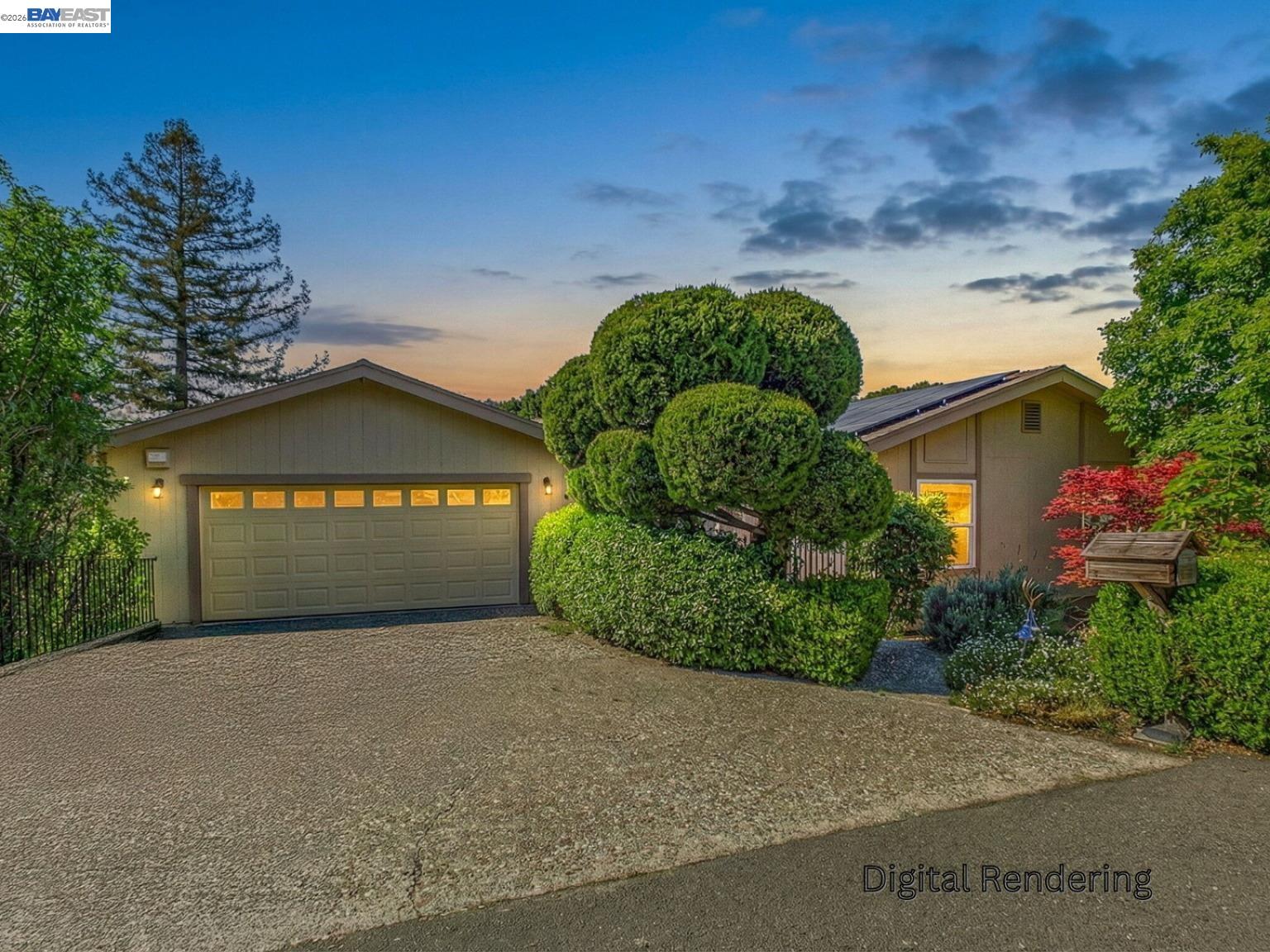 a front view of a house with a yard and garage