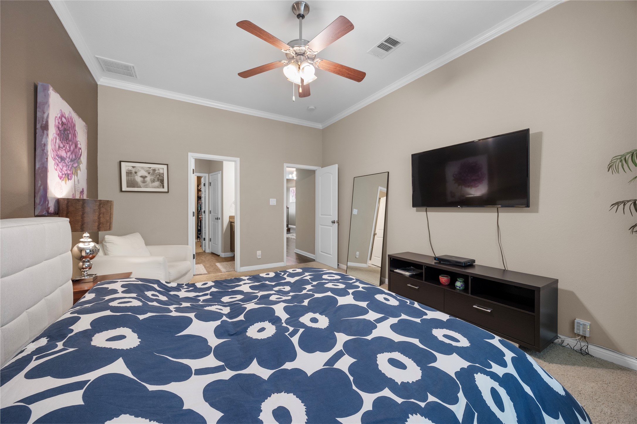 7308 Bandera Ranch Trail, Unit A Austin, TX 78750 - Photo 12 of 27 This room features neutral-toned walls, crown molding, and a ceiling fan with light fixture
