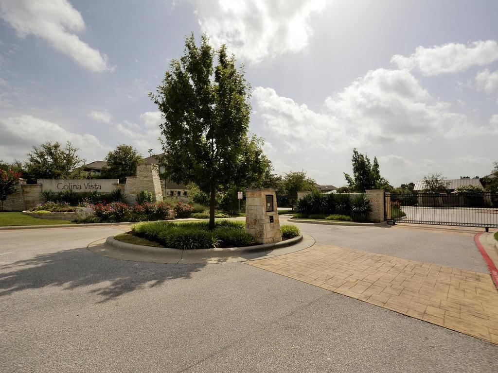 7308 Bandera Ranch Trail, Unit A Austin, TX 78750 - Photo 27 of 27 The property benefits from a gated entrance, stone entry monument with landscaping, and a well-maintained entry road