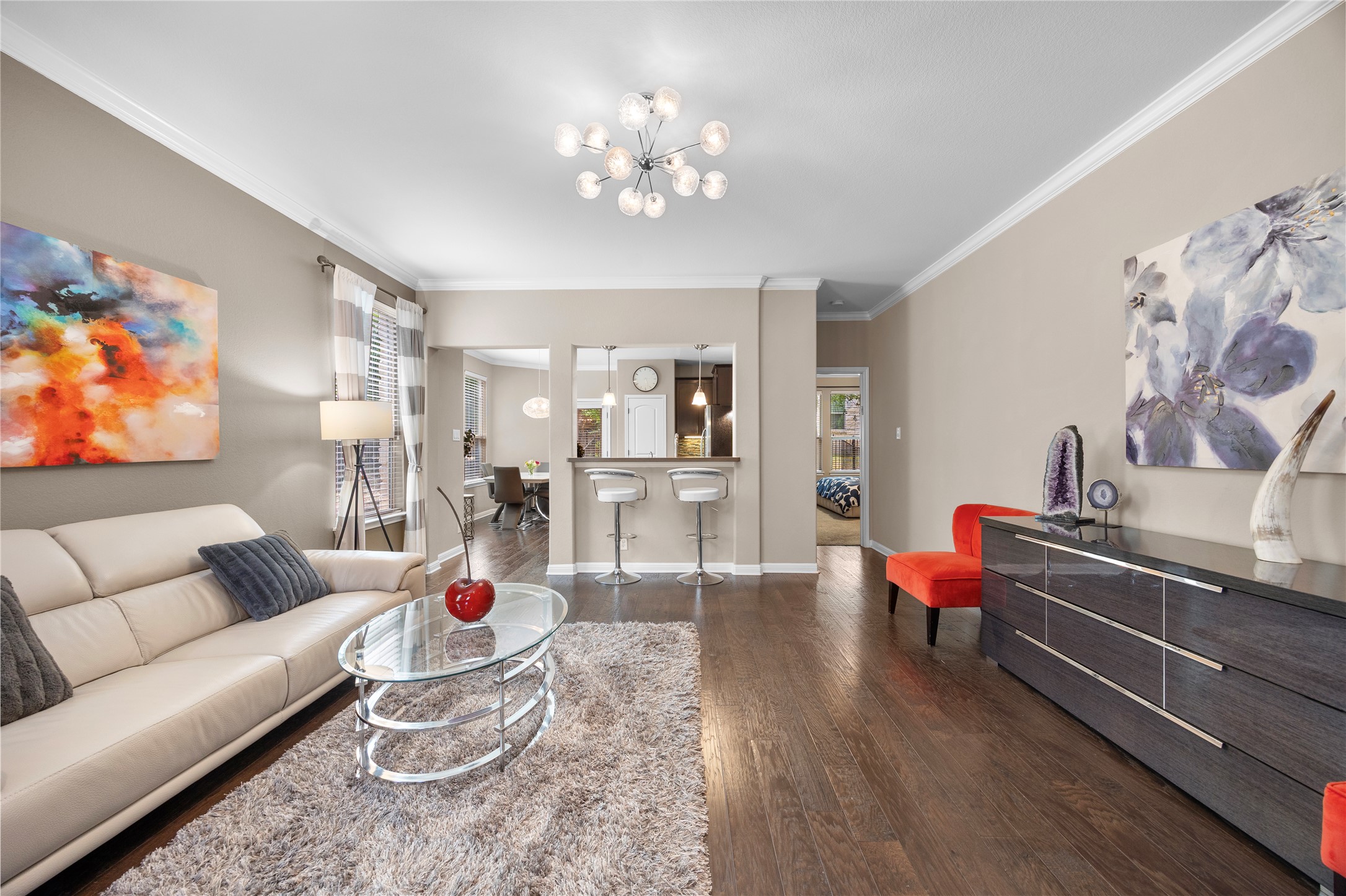 7308 Bandera Ranch Trail, Unit A Austin, TX 78750 - Photo 3 of 27 The living area features hardwood floors, crown molding, and a modern light fixture
