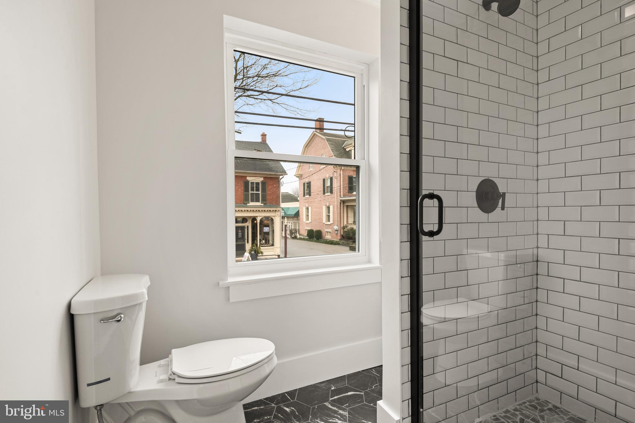 10-14 South Decatur Street, Unit 12C Strasburg, PA 17579 - Photo 11 of 12 a bathroom with a toilet and a shower