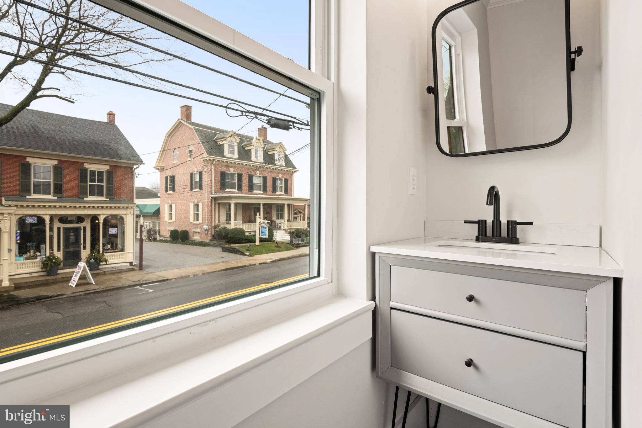 10-14 South Decatur Street, Unit 12C Strasburg, PA 17579 - Photo 12 of 12 a bathroom with a sink and a mirror