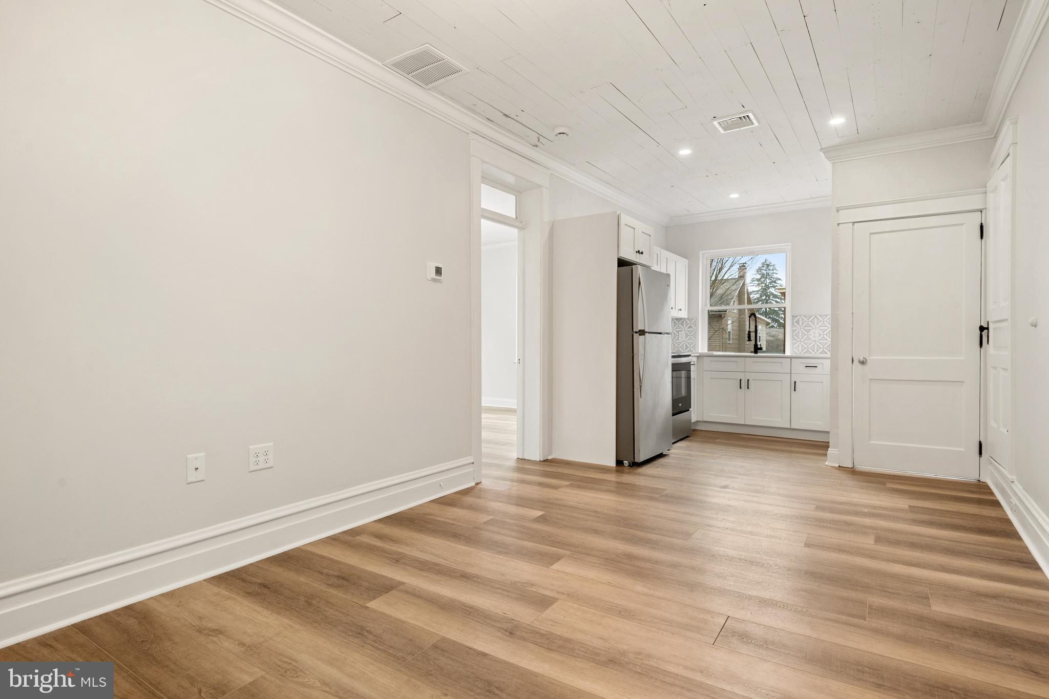 10-14 South Decatur Street, Unit 12C Strasburg, PA 17579 - Photo 3 of 12 a view of a kitchen with a refrigerator and window