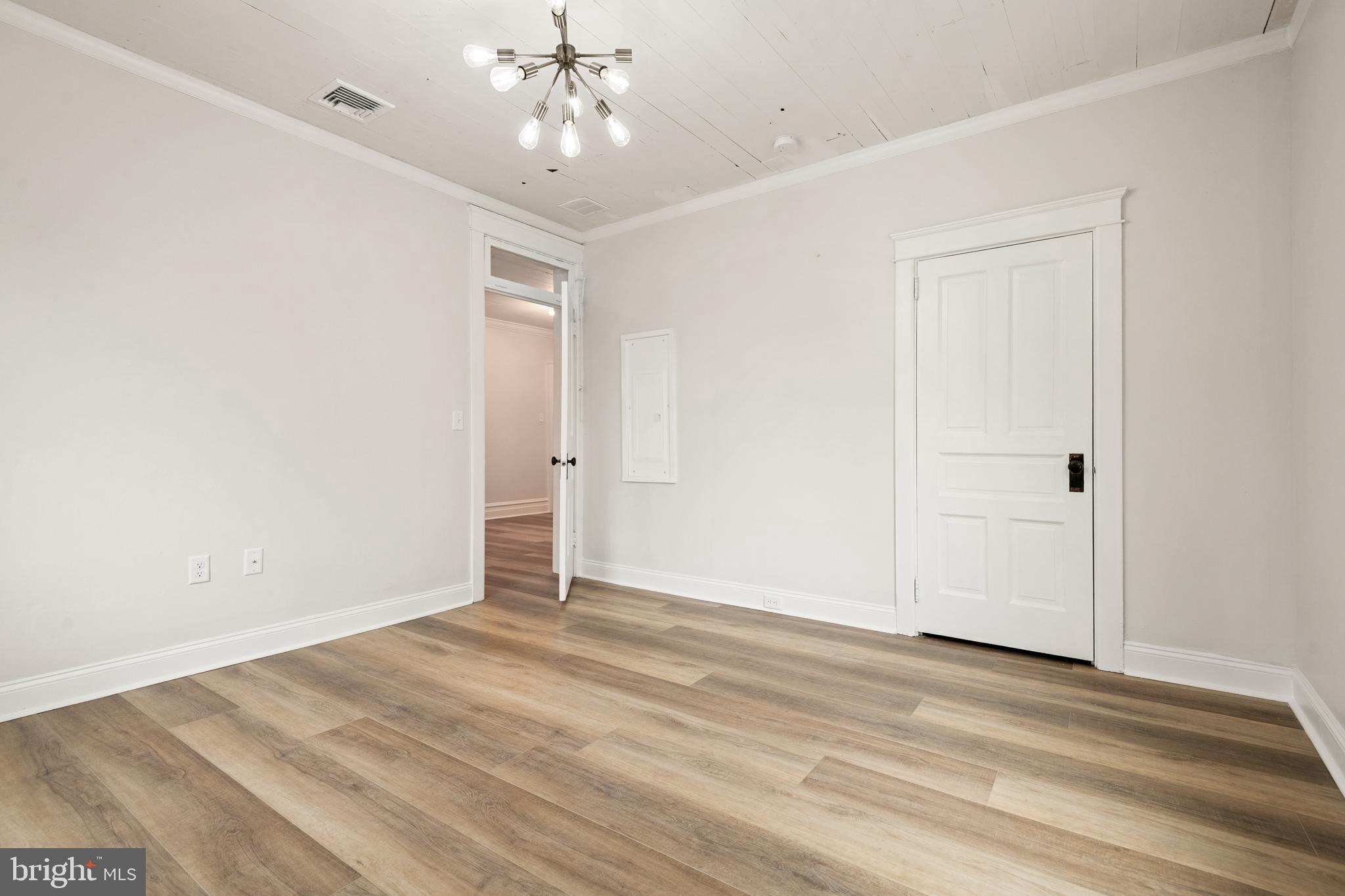 10-14 South Decatur Street, Unit 12C Strasburg, PA 17579 - Photo 5 of 12 a view of an empty room with wooden floor