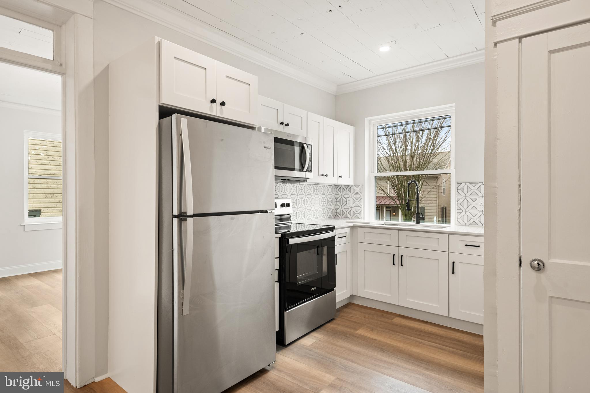 10-14 South Decatur Street, Unit 12C Strasburg, PA 17579 - Photo 6 of 12 a kitchen with stainless steel appliances a refrigerator sink and cabinets