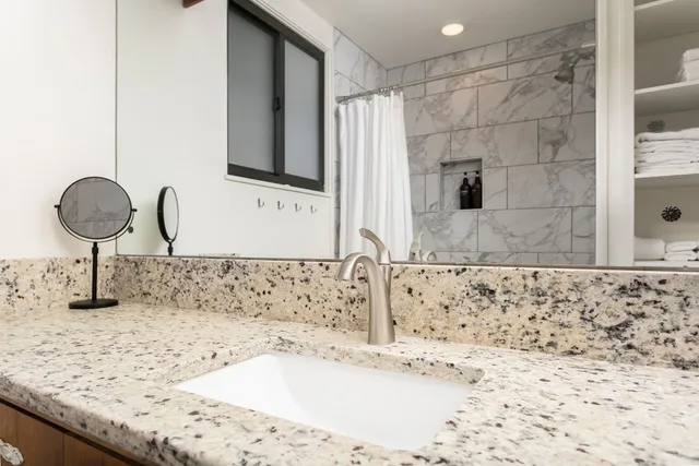 a bedroom with a bed and a couch