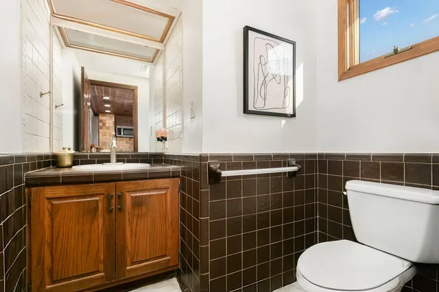 a living room with furniture rug and window