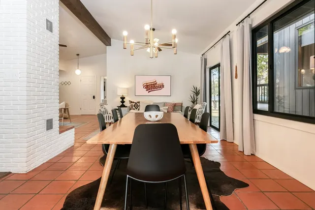 a building outdoor space with patio furniture and potted plants