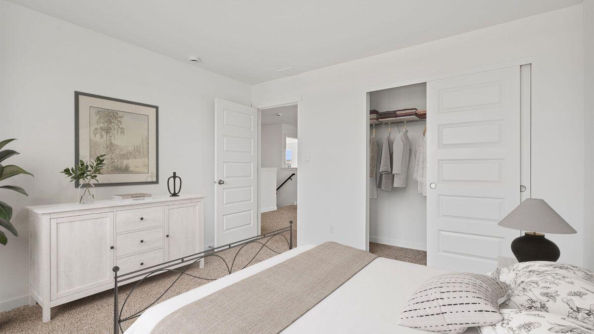 7694 West 107th Place Crown Point, IN 46307 - Photo 11 of 37 a bedroom with a bed and a mirror