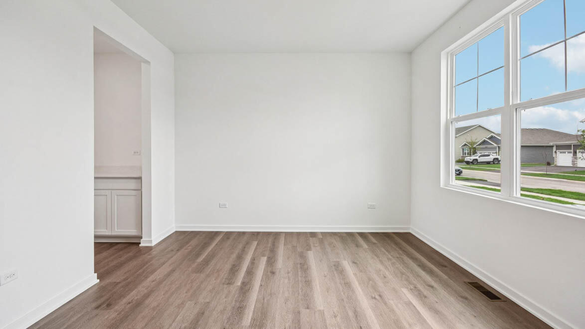 7694 West 107th Place Crown Point, IN 46307 - Photo 15 of 37 wooden floor in an empty room with a window