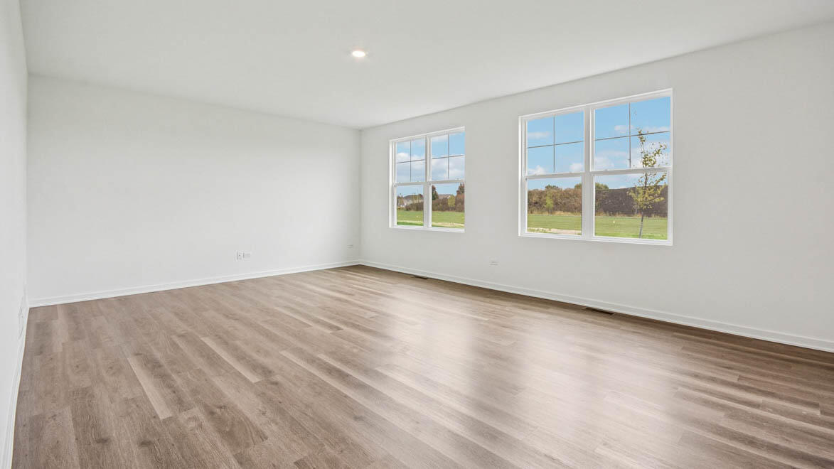 7694 West 107th Place Crown Point, IN 46307 - Photo 19 of 37 an empty room with wooden floor and windows