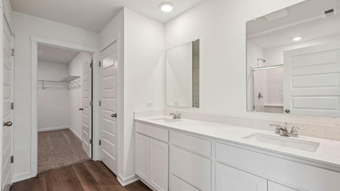 7694 West 107th Place Crown Point, IN 46307 - Photo 26 of 37 a bathroom with a sink and a mirror