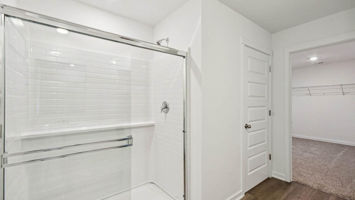 7694 West 107th Place Crown Point, IN 46307 - Photo 27 of 37 a bathroom with a shower and a toilet