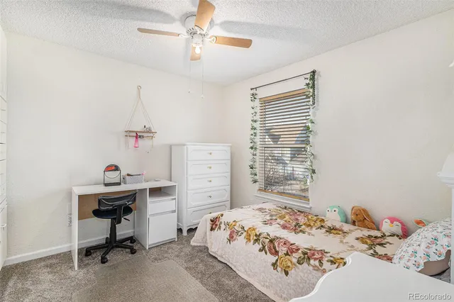 a bedroom that has a bed and a window