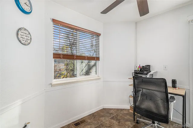 a workspace with furniture and a window