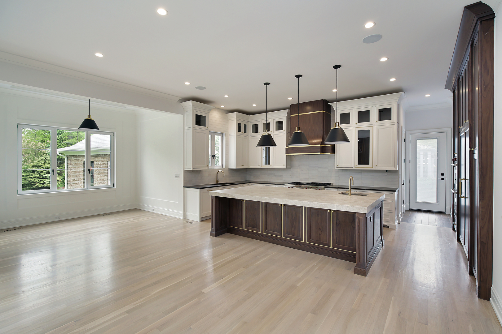 320 Princeton Road Hinsdale, IL 60521 - Photo 4 of 20 a large white kitchen with stainless steel appliances granite countertop a stove and a wooden floors