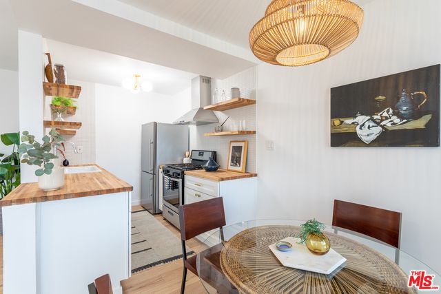 a kitchen with a table and chairs