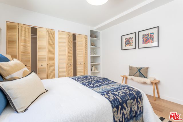 a bedroom with a large bed and a couch