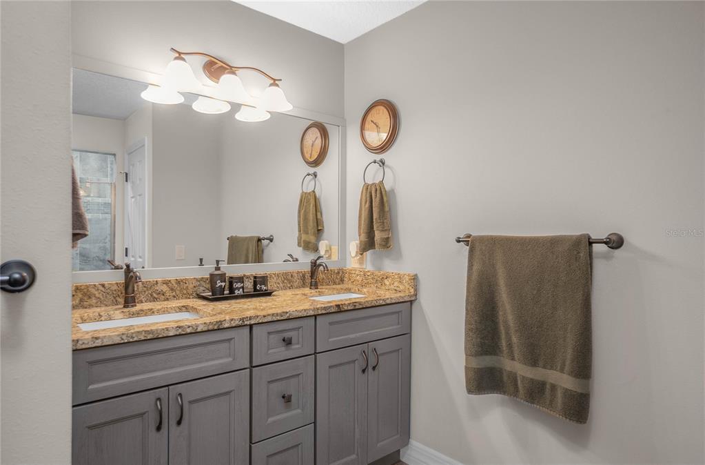 5466 West Tortuga Loop Lecanto, FL 34461 - Photo 21 of 41 a bathroom with a sink and a mirror