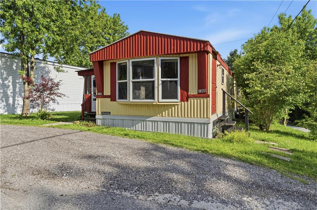 1300 Hidden Valley Road Bulger, PA 15019 - Photo 3 of 25 a front view of a house with a yard