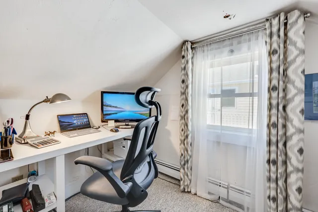 a view of a patio with table and chairs and wooden floor