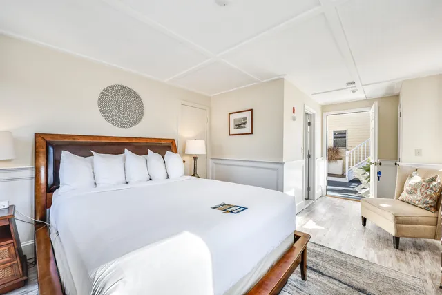 a spacious bedroom with a bed and a couch