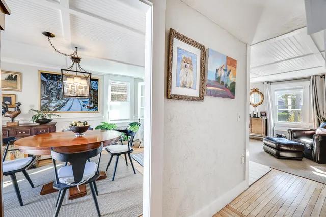 a dining room with furniture and window