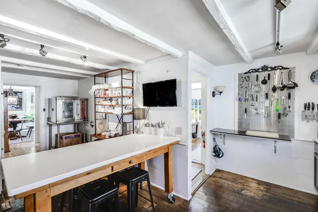 a view of a living room and a flat screen tv
