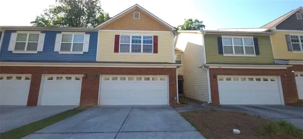 a front view of a house with yard