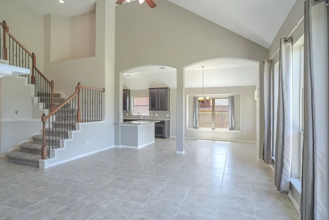 a view of entryway and hall with a fireplace